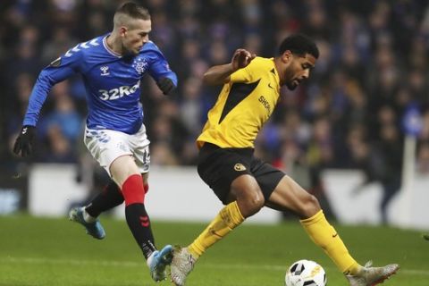 Rangers' Ryan Kent, left, challenges for the ball with Young Boys' Saidy Janko during the Europa League group G soccer match between Rangers and Young Boys at the Ibrox stadium in Glasgow, Scotland, Thursday, Dec. 12, 2019. (AP Photo/Scott Heppell)