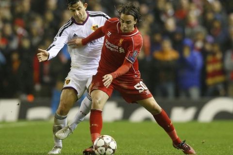Liverpool's Lazar Markovic, right, fights for the ball against Basel's Behrang Safari in the incident which led to the former being shown a red a card by referee Bjorn Kuipers during the Champions League Group B soccer match between Liverpool and FC Basel at Anfield Stadium in Liverpool, England, Tuesday, Dec. 9, 2014. (AP Photo/Jon Super)