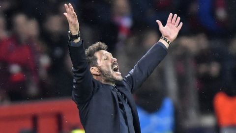 Atletico Madrid coach Diego Simeone gestures during the Champions League, Group D, soccer match between Leverkusen and Atletico Madrid at the BayArena in Leverkusen, Germany, Wednesday, Nov. 6, 2019. (AP Photo/Martin Meissner)