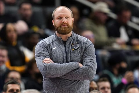 Memphis Grizzlies head coach Taylor Jenkins watches against the Detroit Pistons in the first half of an NBA basketball game in Detroit, Thursday, Feb. 10, 2022. (AP Photo/Paul Sancya)