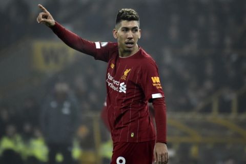 Liverpool's Roberto Firmino gestures during the English Premier League soccer match between Wolverhampton Wanderers and Liverpool at the Molineux Stadium in Wolverhampton, England, Thursday, Jan. 23, 2020. (AP Photo/Rui Vieira)