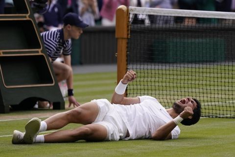 Spain's Carlos Alcaraz celebrates after beating Serbia's Novak Djokovic to win the final of the men's singles on day fourteen of the Wimbledon tennis championships in London, Sunday, July 16, 2023. (AP Photo/Alberto Pezzali)