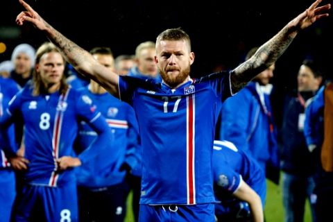FILE - In this Monday Oct. 9, 2017 filer, Iceland's captain Aron Gunnarsson celebrates at the end of the World Cup Group I qualifying soccer match between Iceland and Kosovo in Reykjavik, Iceland. (AP Photo/Brynjar Gunnarsson, File )