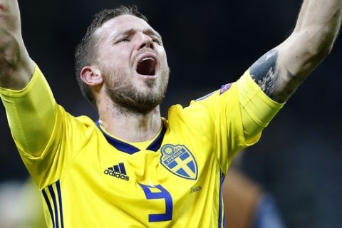 Sweden's Marcus Berg celebrates at the end of the World Cup qualifying play-off second leg soccer match between Italy and Sweden, at the Milan San Siro stadium, Italy, Monday, Nov. 13, 2017. Four-time champion Italy has failed to qualify for World Cup; Sweden advances with 1-0 aggregate win in playoff. (AP Photo/Antonio Calanni)