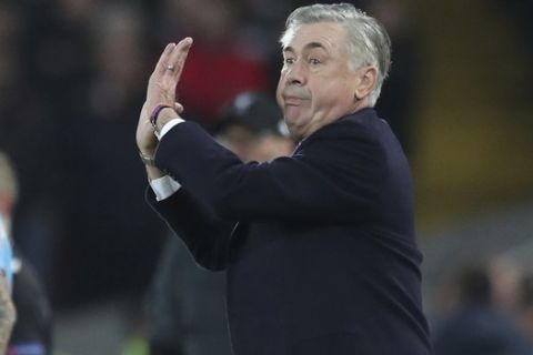 Napoli's head coach Carlo Ancelotti gestures during the Champions League Group E soccer match between Liverpool and Napoli at Anfield stadium in Liverpool, England, Wednesday, Nov. 27, 2019. (AP Photo/Jon Super)
