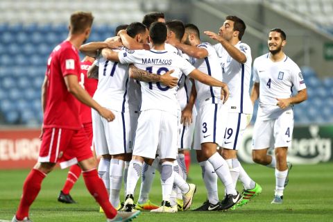Greece players celebrate after scoring the opening goal during the World Cup Group H qualifying soccer match between Gibraltar and Greece outside Faro, southern Portugal, Tuesday, Sept. 6, 2016. (AP Photo/Armando Franca)