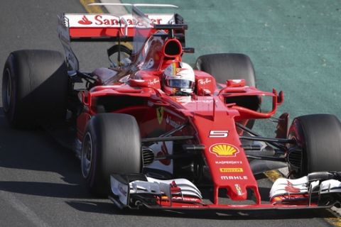 Ferrari driver Sebastian Vettel of Germany steers his car during the Australian Formula One Grand Prix in Melbourne, Australia, Sunday, March 26, 2017. (AP Photo/Rick Rycroft)