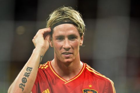 Spanish forward Fernando Torres smiles at the end of the Euro 2012 football championships final match Spain vs Italy on July 1, 2012 at the Olympic Stadium in Kiev. Spain won 4-0.      AFP PHOTO / GABRIEL BOUYS        (Photo credit should read GABRIEL BOUYS/AFP/GettyImages)