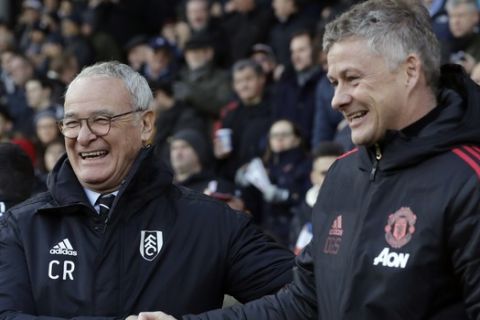 Fulham manager Claudio Ranieri, left, shakes hands with Manchester United caretaker head coach Ole Gunnar Solskjaer prior the English Premier League soccer match between Fulham and Manchester United at Craven Cottage stadium in London, Saturday, Feb. 9, 2019. (AP Photo/Matt Dunham)