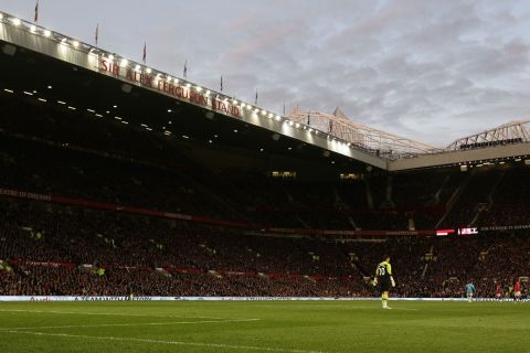The newly named Sir Alex Ferguson Stand at Old Trafford Stadium is seen as Manchester United play Sunderland in their English Premier League soccer match on their manager's 25th anniversary in the job, Manchester, England, Saturday Nov. 5, 2011. (AP Photo/Jon Super)