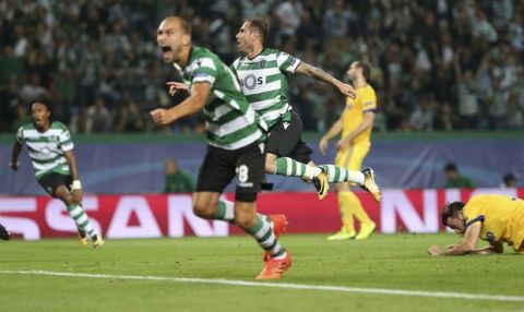 Sporting's Bruno Cesar, third from left, celebrates after scoring his side's opening goal during a Champions League, Group D, soccer match between Sporting CP and Juventus at the Alvalade stadium in Lisbon, Tuesday, Oct. 31, 2017. (AP Photo/Armando Franca)