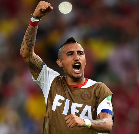 RIO DE JANEIRO, BRAZIL - JUNE 18: Arturo Vidal of Chile celebrates after defeating Spain 2-0 during the 2014 FIFA World Cup Brazil Group B match between Spain and Chile at Maracana on June 18, 2014 in Rio de Janeiro, Brazil.  (Photo by David Ramos/Getty Images)