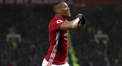 Manchester United's Anthony Martial celebrates scoring his team's second goal of the game, during the English  Premier League soccer match between Manchester United and Watford, at Old Trafford, in Manchester, England, Saturday, Feb. 11, 2017. (Nick Potts/PA via AP)