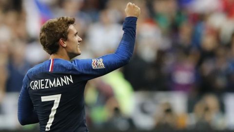 France's Antoine Griezmann celebrates scoring his side's 2nd goal during a UEFA Nations League soccer match between France and Germany at Stade de France stadium in Saint Denis, north of Paris, Tuesday, Oct. 16, 2018. (AP Photo/Christophe Ena)