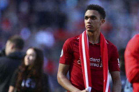 Liverpool's Trent Alexander-Arnold looks at the stands at the end of the English Premier League soccer match between Liverpool and Wolverhampton Wanderers at the Anfield stadium in Liverpool, England, Sunday, May 12, 2019. Despite a 2-0 win over Wolverhampton Wanderers, Liverpool missed out on becoming English champion for the first time since 1990 because title rival Manchester City beat Brighton 4-1. (AP Photo/Dave Thompson)