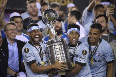 Brazil's Gremio soccer team celebrates winning the Copa Libertadores championship after playing Argentina's Lanus in Buenos Aires, Argentina, Wednesday, Nov. 29, 2017. (AP Photo/Gustavo Garello)