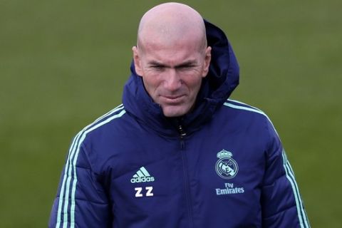 Real Madrid's coach Zidane takes part in a training session at the team's Valdebebas training ground in Madrid, Spain, Tuesday, Nov. 5, 2019. Real Madrid will play against Galatasaray in a Champions League soccer match Group A on Wednesday. (AP Photo/Manu Fernandez)