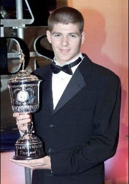 steven gerrard celebrates with trophy after winning the professional footballers association young player of the year award