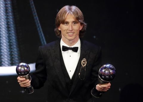 Croatia's Luka Modric receives the Best FIFA Men's Player award during the ceremony of the Best FIFA Football Awards in the Royal Festival Hall in London, Britain, Monday, Sept. 24, 2018. (AP Photo/Frank Augstein)