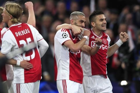 Ajax's Hakim Ziyech celebrates with Dusan Tadic, right,after scoring his side's second goal during the Champions League semifinal second leg soccer match between Ajax and Tottenham Hotspur at the Johan Cruyff ArenA in Amsterdam, Netherlands, Wednesday, May 8, 2019. (AP Photo/Peter Dejong)