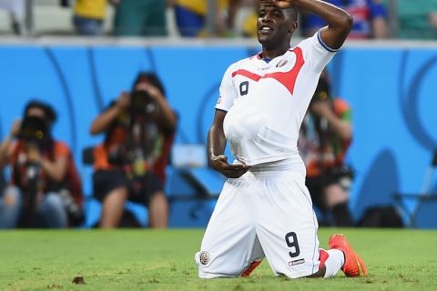 FORTALEZA, BRAZIL - JUNE 14: Joel Campbell of Costa Rica celebrates scoring his team's first goal with the ball under his jersey during the 2014 FIFA World Cup Brazil Group D match between Uruguay and Costa Rica at Castelao on June 14, 2014 in Fortaleza, Brazil.  (Photo by Laurence Griffiths/Getty Images)