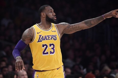 Los Angeles Lakers forward LeBron James gestures during the first half of an NBA basketball game against the Indiana Pacers Thursday, Nov. 29, 2018, in Los Angeles. (AP Photo/Mark J. Terrill)