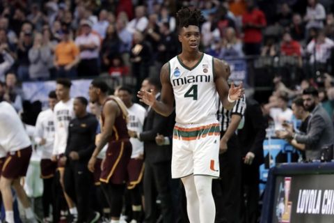 Miami guard Lonnie Walker IV (4) looks to the bench after losing the ball out of bounds in the final seconds of the second half of a first-round game against Loyola-Chicago at the NCAA college basketball tournament in Dallas, Thursday, March 15, 2018. (AP Photo/Tony Gutierrez)