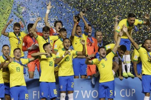 Brazilian players celebrate after their team's 2-1 victory over Mexico at the end of FIFA U-17 World Cup Brazil 2019 final soccer match at Arena Bezerrao in Brasilia, Brazil, Sunday, Nov. 17, 2019. (AP Photo/Eraldo Peres)