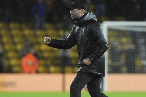 Liverpool manager Juergen Klopp celebrates at the end of the English Premier League soccer match between Wolverhampton Wanderers and Liverpool at the Molineux Stadium in Wolverhampton, England, Friday, Dec. 21, 2018. (AP Photo/Rui Vieira)