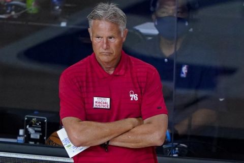 Philadelphia 76ers head coach Brett Brown watches his team play against the Washington Wizards during the second half of an NBA basketball game Wednesday, Aug. 5, 2020 in Lake Buena Vista, Fla. (AP Photo/Ashley Landis)