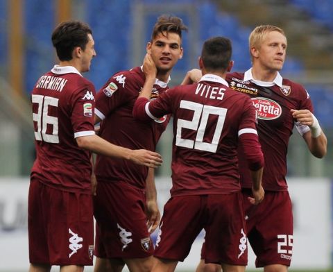 ROME, ITALY - APRIL 19:  Panagiotis Tachtsidis (C) with his teammates of Torino FC celebrates after scoring the second team's goal during the Serie A match between SS Lazio and Torino FC at Stadio Olimpico on April 19, 2014 in Rome, Italy.  (Photo by Paolo Bruno/Getty Images)