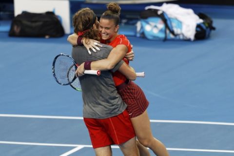 Stefanos Tsitsipass and Maria Sakkari of Greece celebrate winning their mixed doubles match against Serena Williams and Frances Tiafoe of the United States at the Hopman Cup in Perth, Australia, Monday, Dec. 31, 2018. (AP Photo/Trevor Collens)