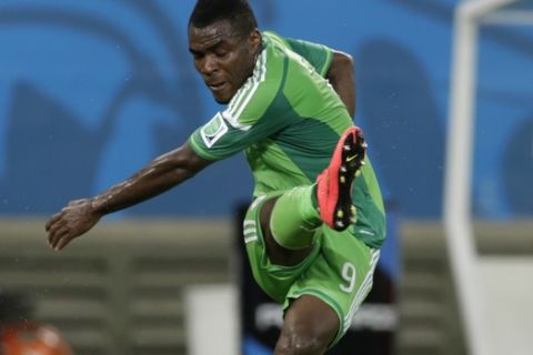 Nigeria's Emmanuel Emenike fires in a shot on goal during the group F World Cup soccer match between Nigeria and Bosnia at the Arena Pantanal in Cuiaba, Brazil, Saturday, June 21, 2014. (AP Photo/Dolores Ochoa)