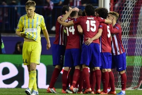 Atletico Madrid players celebrate after scoring a goal during the UEFA Champions League group C football match Club Atletico de Madrid vs FC Astana at the Vicente Calderon stadium in Madrid on October 21, 2015.   AFP PHOTO/ JAVIER SORIANO        (Photo credit should read JAVIER SORIANO/AFP/Getty Images)