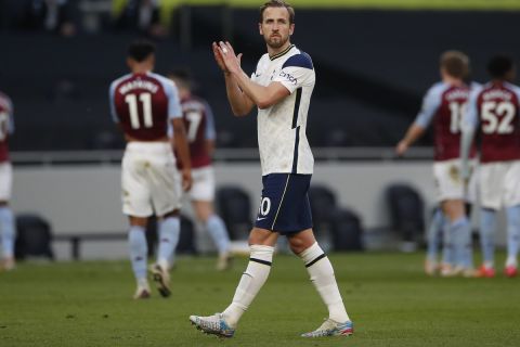 Tottenham's Harry Kane applauds to supporters at the end of the English Premier League soccer match between Tottenham Hotspur and Aston Villa at the Tottenham Hotspur Stadium in London, Wednesday, May 19, 2021. (Paul Childs/Pool via AP)