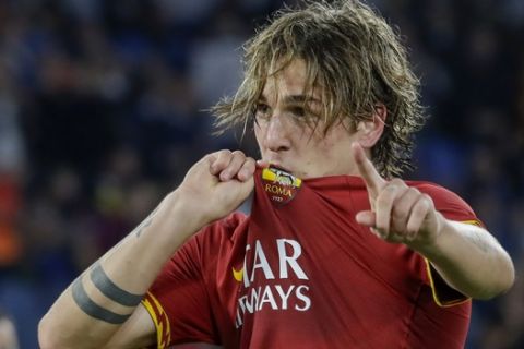 Roma's Nicolo Zaniolo celebrates after he scored his side's second goal during a Serie A soccer match between Roma and AC Milan, at Rome's Olympic Stadium, Sunday, Oct. 27, 2019. (AP Photo/Andrew Medichini)