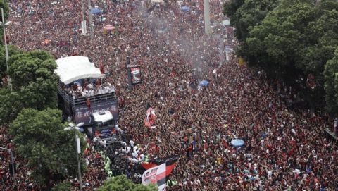 Players of Brazil's Flamengo parade at their arrival in Rio de Janeiro, Brazil, Sunday, Nov. 24, 2019. Flamengo overcame Argentina's River Plate 2-1 in the Copa Libertadores final match on Saturday in Lima to win its second South American title. (AP Photo/Silvia Izquierdo)