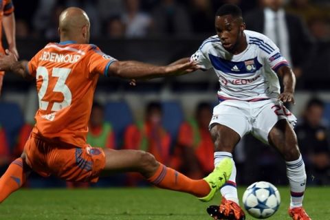 Lyon's French forward Aldo Kalulu (R) vies with Valencia's Tunisian defender Aymen Abdennour (L) during the Champions League group H football match between Lyon and Valencia on September 29, 2015 at the Gerland stadium in Lyon, central-eastern France.  AFP PHOTO / PHILIPPE DESMAZES        (Photo credit should read PHILIPPE DESMAZES/AFP/Getty Images)