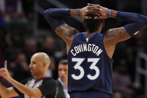 Minnesota Timberwolves forward Robert Covington (33) watches as referee Aaron Smith calls a foul during the second half of an NBA basketball game, Monday, Nov. 11, 2019, in Detroit. (AP Photo/Carlos Osorio)