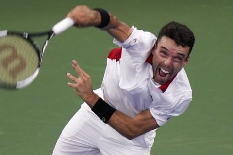Roberto Bautista Agut, of Spain, serves to Novak Djokovic, of Serbia, during the semifinals at the Western & Southern Open tennis tournament Friday, Aug. 28, 2020, in New York. (AP Photo/Frank Franklin II)