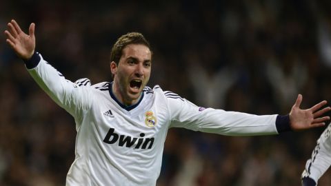 Real Madrid's Argentinian forward Gonzalo Higuain celebrates after scoring during the UEFA Champions League quarter-final first leg football match Real Madrid vs Galatasaray on April 3, 2013 at Santiago Bernabeu stadium in Madrid.  AFP PHOTO / JAVIER SORIANO        (Photo credit should read JAVIER SORIANO/AFP/Getty Images)