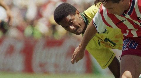 United States defender Paul Caligiuri, right, and Brazilian defender Mazinho battle for control of the ball during their World Cup soccer championship second-round match at Stanford Stadium in Stanford, Calif., Monday, July 4, 1994. (AP Photo/Thomas Kienzle)