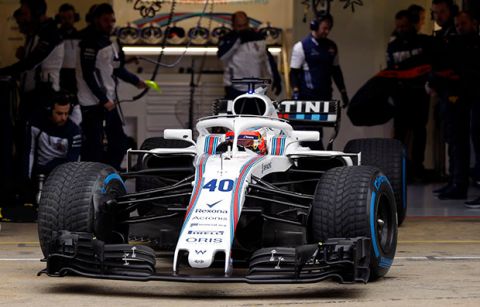 Williams reserve driver Robert Kubica of Poland leaves the team box during a Formula One pre-season testing session at the Catalunya racetrack in Montmelo, outside Barcelona, Spain, Tuesday, Feb. 27, 2018. (AP Photo/Francisco Seco)