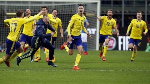 Sweden's players celebrate at the end of the World Cup qualifying play-off second leg soccer match between Italy and Sweden, at the Milan San Siro stadium, Italy, Monday, Nov. 13, 2017. The match ended in a 0-0 draw and Sweden qualified for the World Cup final stage. (AP Photo/Antonio Calanni)