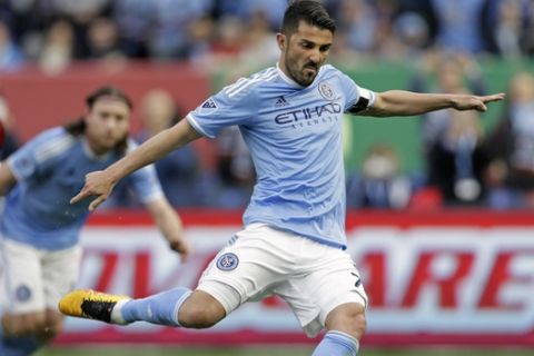 New York City FC forward David Villa scores a penalty kick goal against the Toronto FC during the first half of an MLS soccer game at Yankee Stadium on Sunday, March 13, 2016, in New York. (AP Photo/Adam Hunger)