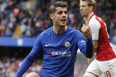 Chelsea's Alvaro Morata gestures after a tackle by Arsenal's Nacho Monreal, rear, during the English Premier League soccer match between Chelsea and Arsenal at Stamford Bridge stadium in London, Sunday, Sept. 17, 2017. (AP Photo/Frank Augstein)
