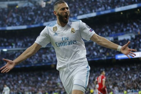 Real Madrid's Karim Benzema celebrates after scoring his side's opening goal during the Champions League semifinal second leg soccer match between Real Madrid and FC Bayern Munich at the Santiago Bernabeu stadium in Madrid, Spain, Tuesday, May 1, 2018. (AP Photo/Paul White)