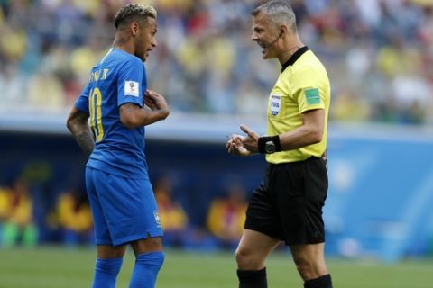 Brazil's Neymar, left, reacts as he talks with referee Bjorn Kuipers from Netherlands during the group E match between Brazil and Costa Rica at the 2018 soccer World Cup in the St. Petersburg Stadium in St. Petersburg, Russia, Friday, June 22, 2018. (AP Photo/Alastair Grant)