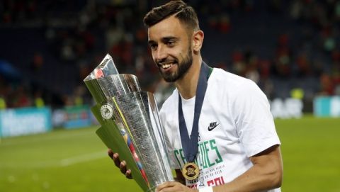 Portugal's Bruno Fernandes poses with the trophy at the end of the UEFA Nations League final soccer match between Portugal and Netherlands at the Dragao stadium in Porto, Portugal, Sunday, June 9, 2019. Portugal won 1-0. (AP Photo/Armando Franca)