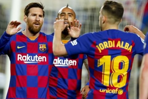 Barcelona's Jordi Alba, right, celebrates with Barcelona's Lionel Messi before the goal he scored was disallowed after a VAR decision during a Spanish La Liga soccer match between Barcelona and Real Sociedad at the Camp Nou stadium in Barcelona, Spain, Saturday, March 7, 2020. (AP Photo/Joan Monfort)